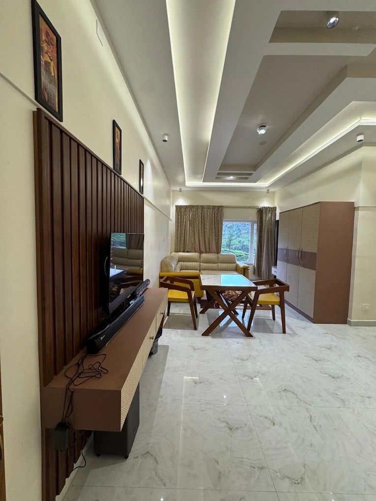 Family suite interior with entertainment wall and marble flooring