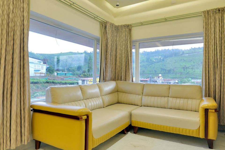 Corner sofa with panoramic windows over Nilgiri tea gardens